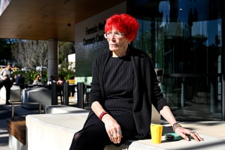 Judy Deacon sits outside the coroner's court