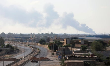 Smoke rises during clashes