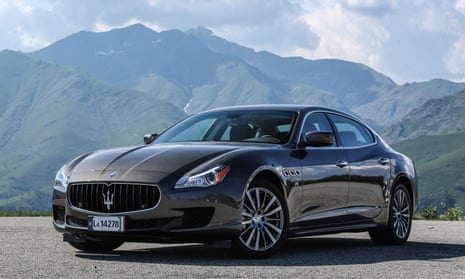 Maserati’s Quattroporte parked in front of a mountain