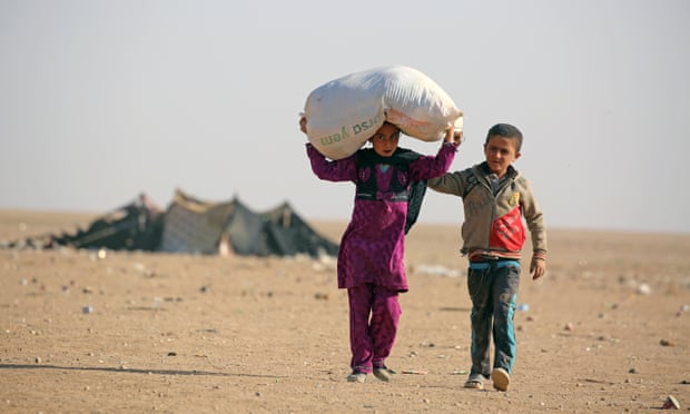 Child refugees from the northern Iraqi city of Mosul make their way to the Al-Hol camp, close to the Iraqi border in northeastern Syria.