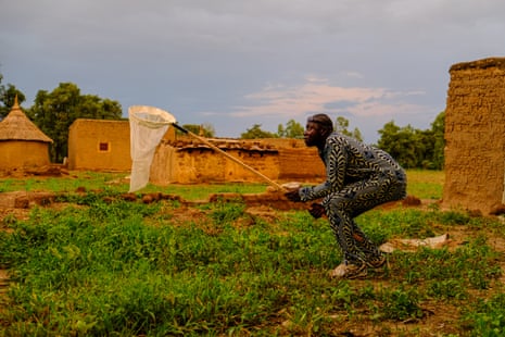 A mosquito catcher at work in Bana, Burkina Faso