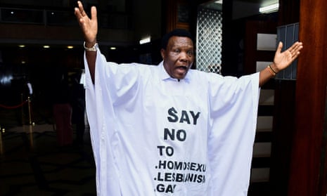 John Musira, a Ugandan MP, attends a debate in the parliament dressed in an anti-gay frock.