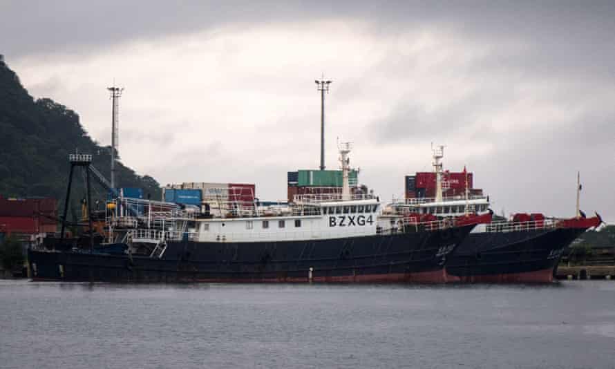 A pair of Chinese fishing vessels are berthed at an unused wharf in Port Vila as Vanuatu authorities consider their next steps. The crew will be quarantined before they can be released.