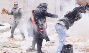 Ibi, Spain. 28th Dec, 2016. Revellers take part in the battle of 'Enfarinats', a flour fight in celebration of the Els Enfarinats festival on December 28, 2015 in Ibi, Spain. Citizens of Ibi annually celebrate the festival with a battle using flour, eggs and firecrackers. The battle takes place between two groups, a group of married men called 'Els Enfarinats' which take the control of the village for one day pronouncing a whole host of ridiculous laws and fining the citizens that infringe them and then another group called 'La Oposicio' which try to restore order.