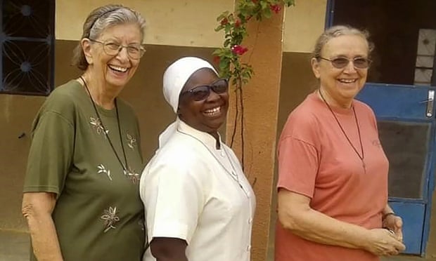 This undated photo courtesy of Marianites of Holy Cross, shows from left, Sister Suellen Tennyson, with Sister Pascaline Tougma, a midwife from Burkina Faso, and Sister Pauline Drouin, a nurse from Lake Magantic in Canada. Sister Suellen Tennyson was taken from her bed in Yalgo, Burkina Faso, late Monday, April 4, 2022 , Sister Ann Lacour, U.S. congregational leader for the Marianites of Holy Cross in Covington, Louisiana, told The Associated Press. (Courtesy of Marianites of Holy Cross via AP)