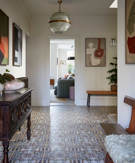 Reclaimed hall tiles, a sideboard left by the previous owners and contemporary artwork