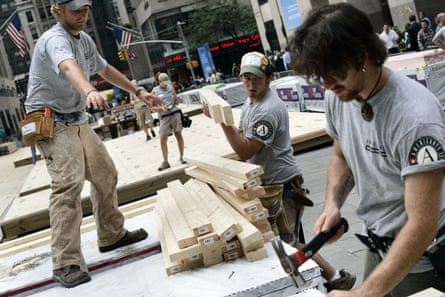 men work with planks of wood