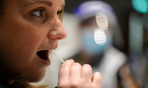 woman takes the lateral flow test on in Portsmouth, England.