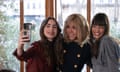 In this his handout photo taken by Stephanie Branchu for Netflix on April 2, 2024, in Paris, Lily Collins, left, French President Emmanuel Macron's wife Brigitte Macron, center, and Brigitte Macron poses for a selfie during shooting of Emily in Paris with Lily Collins, left, and Thalia Besson, right.