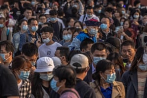 Tourists leave the Forbidden City in Beijing.