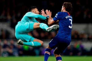 Tottenham Hotspur goalkeeper Paulo Gazzaniga gives away a penalty for this challenge on Chelsea defender Marcos Alonso. Chelsea won 2-0 in a game marred by racist abuse from the stands.