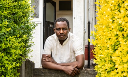 Mohammed Jouda, who has recovered from coronavirus outside his shared flat in north London.