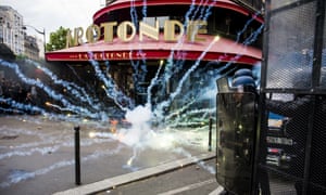 Protesters and police confront each other at a demonstration in Paris