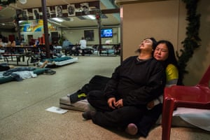 Steve Moses and Marie Nickolai sit on a mattress in Bean’s Cafe.