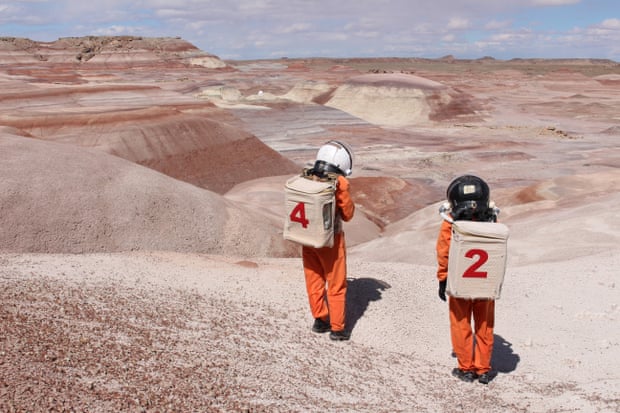 Artists Ella Good and Nicki Kent in astronaut suits at the Mars Desert Research Station, Utah.