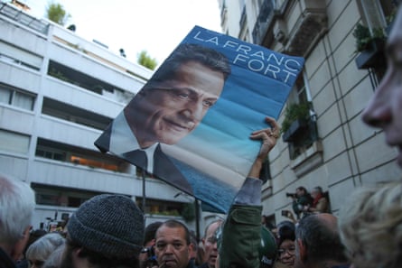 Supporters of Nicolas Sarkozy gather near the residence of the former French president in Paris on the day his prison sentence started, 21 October 2025.