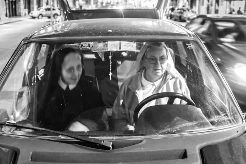 Sister Erminia and Sister Pina in the community car on their commute to feed the homeless.