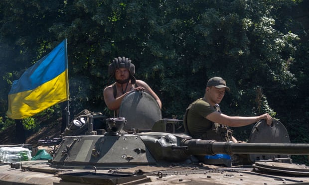 Ukrainian soldiers drive to the front line in eastern Ukraine