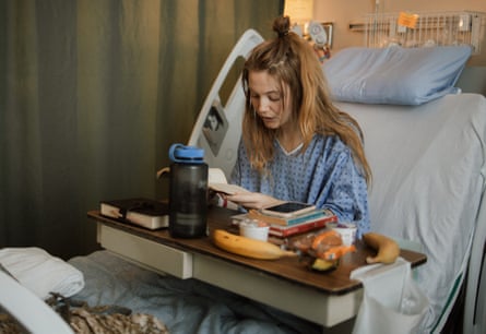 Emma Cardinal sitting in a hospital bed.