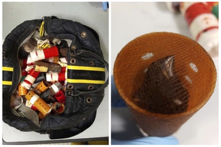 A bag containing hair curlers used to smuggle live finches into the US from Guyana, and a finch inside one of the rollers.