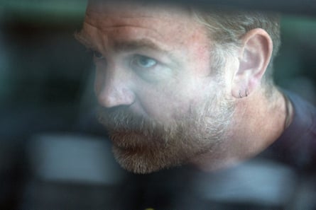 a man looking through a window