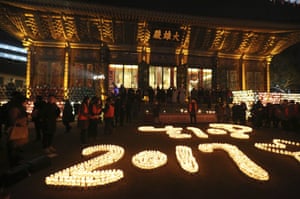 Buddhists light candles at Jogye Temple in Seoul, South Korea