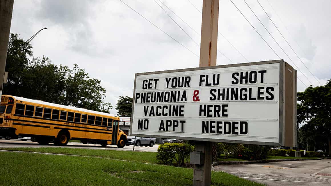 A sign advertises vaccine shots in Miami.
