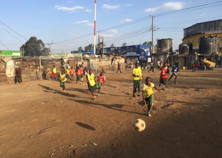 Children play football on a former dump in Mathare, a shanty town where plastic rubbish was once as high as a man, say locals.