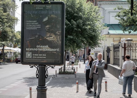 A poster, which pictures a soldier, on a street