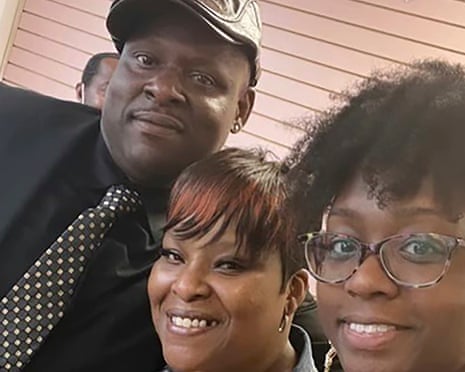 three people pose for a selfie