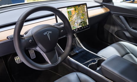 Tesla Model 3 compact full electric car with a full self-driving system. 