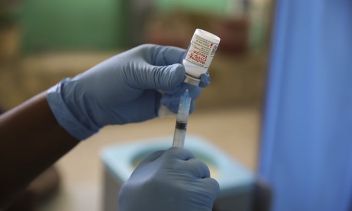 A medical worker prepares a shot of the Moderna vaccine.