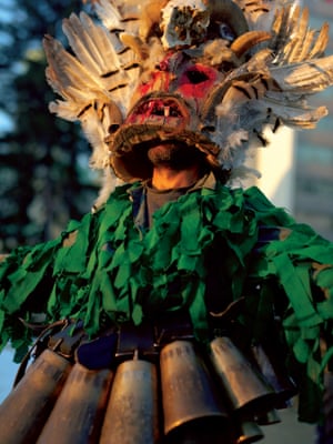 Surva festival, Pernik, Bulgaria, 2018 A man takes part in one of the many parades in the city of Pernik, Bulgaria during the annual Surva festival. Following a 1,000-year-old pagan tradition, men and women wear frightening masks, costumes and heavy bells meant to scare devils away. They parade through the streets of their villages and towns in hope of a good harvest and the return of spring