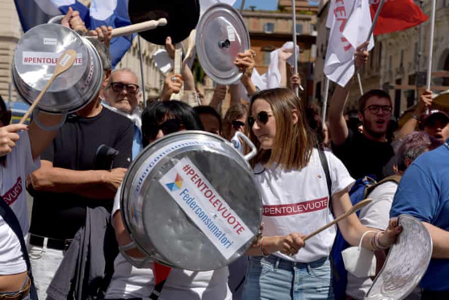 Italians conduct an ‘empty pots’ protest against rising living costs in Piazza Santi Apostoli, Rome.