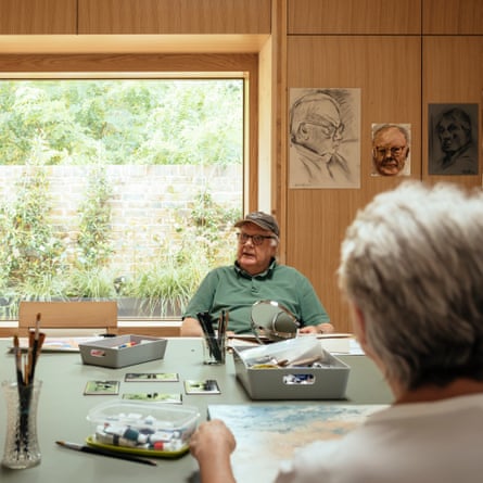 Residents join in an art class.