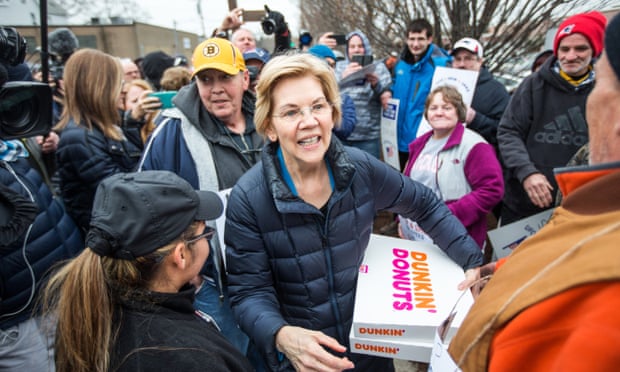 The Democratic presidential candidate Senator Elizabeth Warren greets striking Stop &amp; Shop workers while also bringing coffee and donuts on Friday in Somerville, Massachusetts.