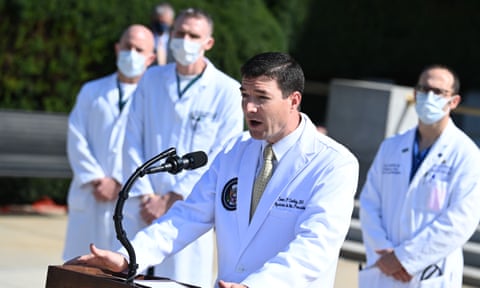 White House physician Sean Conley speaks at a podium