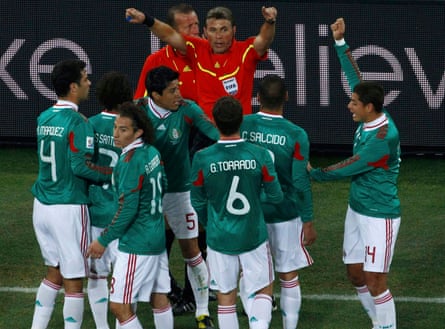 Mexico’s players argue in vain with referee Roberto Rosetti after Carlos Tevez’s contentious goal for Argentina at the 2010 World Cup