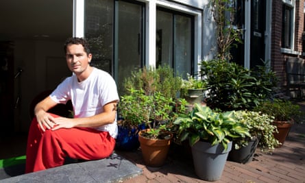 Ryan Pugh outside his house with his plants