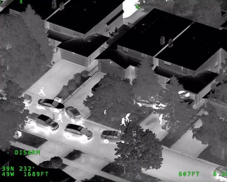 Black and white screengrab showing block of houses and cars from Toronto Police Helicopter