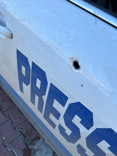 The reporter said their car was signposted as press and that the fire came from the east bank of the Dnieper River, where Russian forces are stationed.