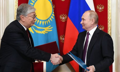 Russian President Vladimir Putin shakes hand with his Kazakhstan’s counterpart Kassym-Jomart Tokayev.