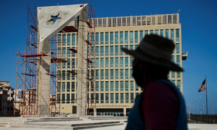 A worker looks at a huge concrete Cuban flag being built in front of the US embassy in Havana last month.
