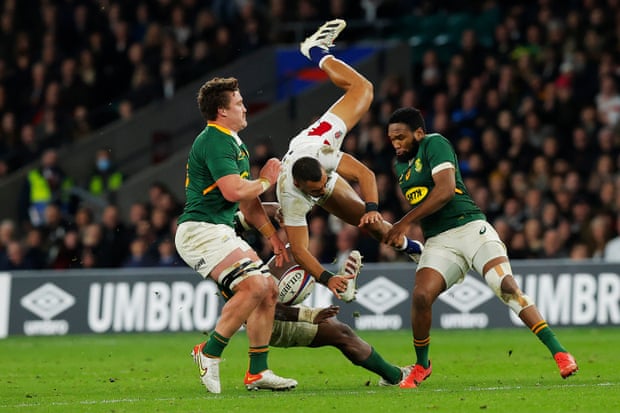 Joe Marchant is upended by Siya Kolisi (obscured), resulting in a yellow card for the Springboks captain.