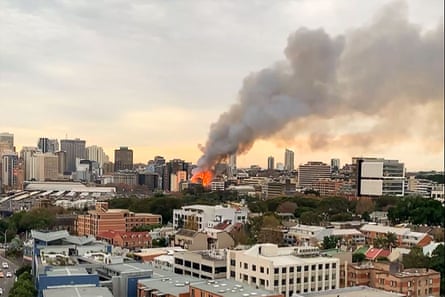 This screen grab from a UGC video taken and posted by Michael Goode on Facebook shows the plume of smoke rising above central Sydney.