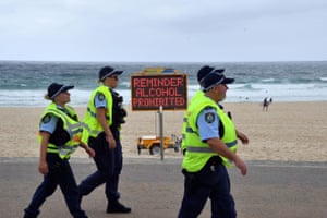 Police officers patrol the almost empty Bondi Beach on Christmas Day in Sydney.