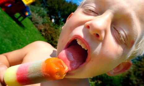 A boy licking an ice lolly