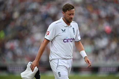 Ollie Robinson leaves the field mid-way through an over.