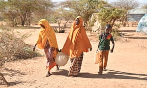 People return after fetching water to the internal displaced person camp in Somalia at Doolow, a border town with Ethiopia