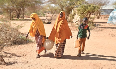 Somalians fleeing drought fetch water at a camp in Doolow as humanitarian agencies warn that famine could affect 6.2 million peopl.